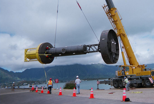 image of 40kW power Buoy being hoisted into the water off Hawaii