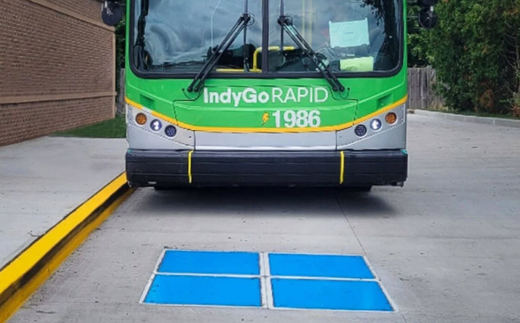 image of InductEV wireless charging pad and bus aproaching